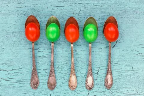 Five Easter eggs in old silver spoon on bright background. Top view Stock-Fotos