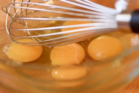Five Eggs With Wisk Stock Photos