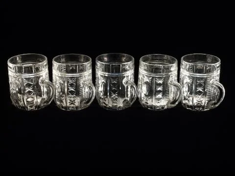 Five empty beer glasses on a black background Stock Photos