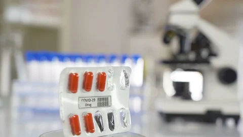 Five empty shells of the Covid-19 drug for coronavirus Stock Footage 127703407