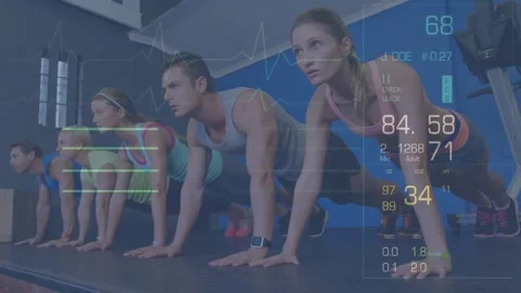 Five exercisers holding plank on raised mat, fitness trackers sending data, ECG Stock Footage 330717869