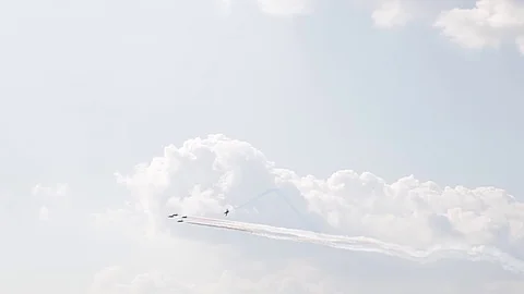 Five fighter jets in the blue sky. A general plan. Aerobatic figures. Airshow Stock Footage 124146201