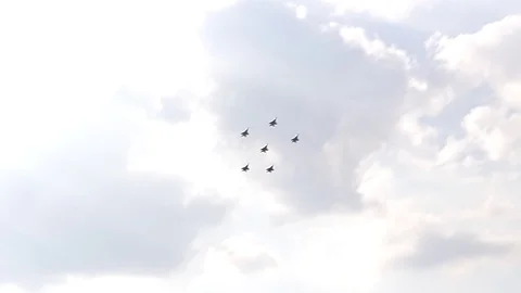 Five fighter jets in the blue sky. A general plan. Aerobatic figures. Airshow Stock Footage 124146469