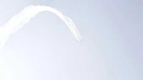 Five fighter jets in the blue sky. White color. A general plan. Aerobatic Stock Footage 124146679