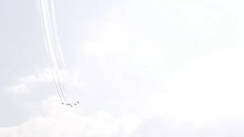 Five fighter jets in the blue sky. White color. A general plan. Aerobatic Stock Footage 124146688