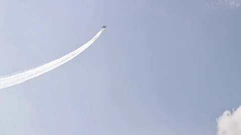 Five fighter jets in the blue sky. White color. A general plan. Aerobatic Stock Footage 124146763