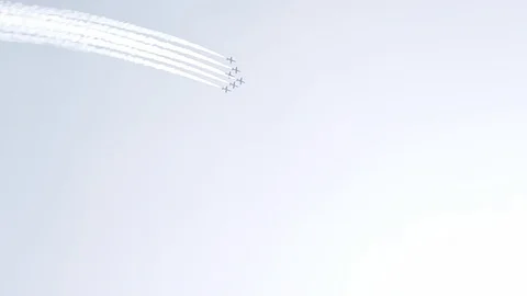 Five fighter jets in the blue sky. White color. A general plan. Aerobatic Stock Footage 124146824
