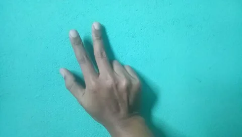 Five fingers on the wall on a blue background1 Stock Footage 220829850