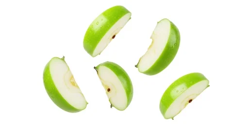 Five floating green apple slices isolated on white Stock Footage 339340816