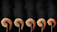 Five Freshly Cooked Prawns On Sticks Steaming On Black Background Prores Hq Stock Footage