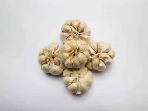 Five garlics on a white background Stock Photos