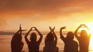 Five Girls Spell &Quot;Love,&Quot; Make Heart W/Hands At Sunset On The Beach Stock Footage