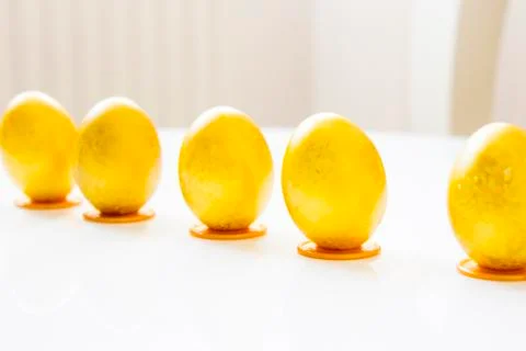 Five gold easter eggs on the table Stock Photos