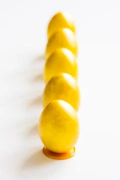 Five gold easter eggs on the table Stock Photos