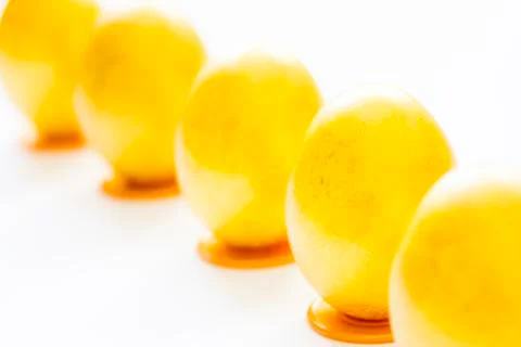 Five gold easter eggs on the table Stock Photos