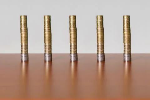 Five groups of euro coins on the table Stock Photos