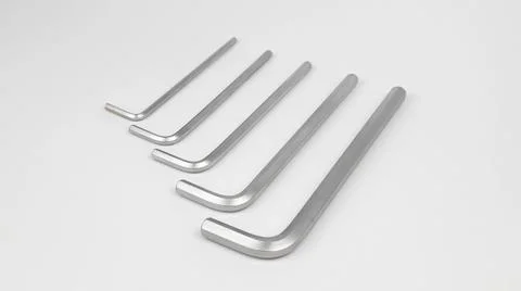 Five hex keys on a white background. A set of metal tools. Stock Photos