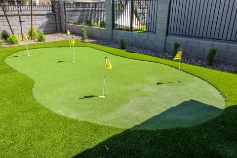 Five Hole Putting Green In Backyard Stock Photos