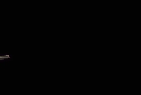 Five horizontal muzzle flashes from barrel of .357 Magnum revolver Stock Footage 86884289
