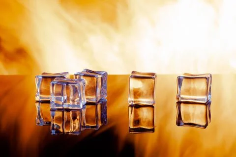 Five ice cubes against the flames, copy space Stock Photos