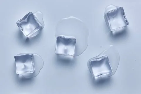 Five ice cubes melting on a white background. Deep focus stacking. Ice cold. Stock Photos