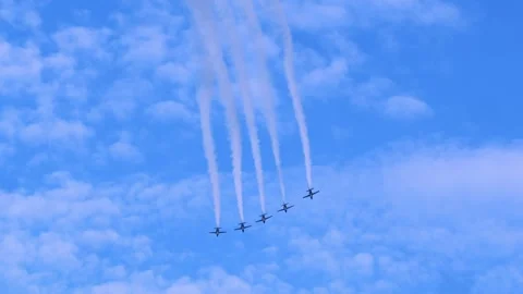 Five identical aircrafts perform formation flight with smoke. Stock Footage 314377128