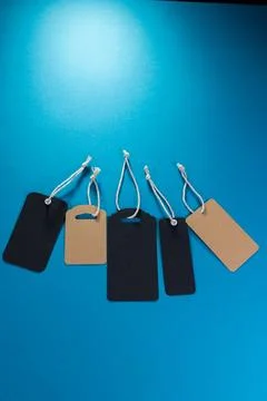 Five labels of different shapes on a blue background that can be used as a .. Stock-Fotos