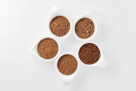 Five levels of ground coffee beans. Stock Photos