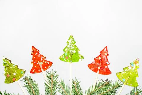 Five lollipops in the shape of a Christmas. Stock Photos