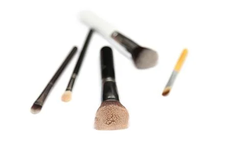 Five makeup brushes isolated on white background Stock Photos