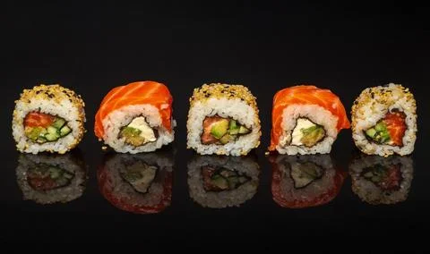 Five maki rolls in a row with salmon, avocado Stock Photos