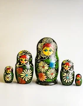 Five Matryoshka dolls of different sizes, Russian wooden doll on a white back Stock Photos