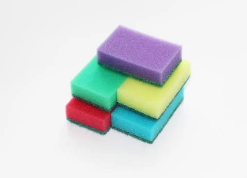 Five multi-colored sponges for cleaning the apartment and washing dishes. Stock Photos
