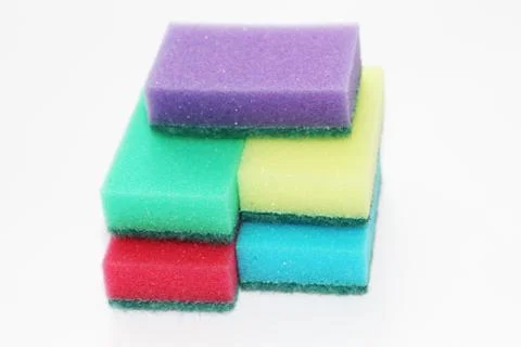 Five multi-colored sponges for cleaning the apartment and washing dishes. Stock Photos