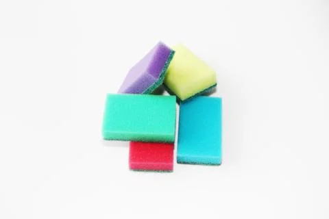 Five multi-colored sponges for cleaning the apartment and washing dishes. Stock Photos