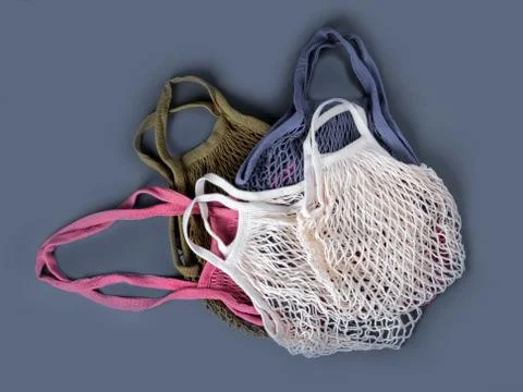 Five multicolor reusable string bags for different products. Stock Photos