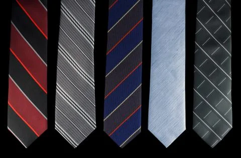 Five neckties in different colors Stock Photos