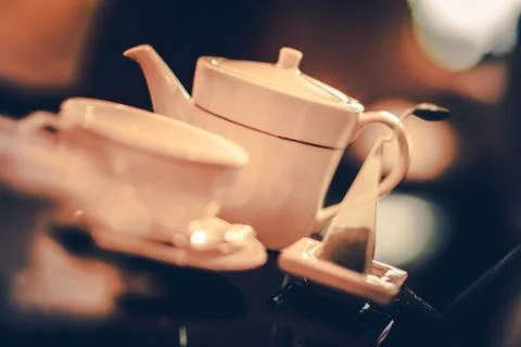 Five Oclock Tea Time. Tea Pot Full of Tasteful Fresh Brewed Hot Tea. 库存照片