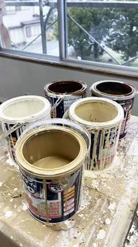 Five old paint can for wall Stock Photos
