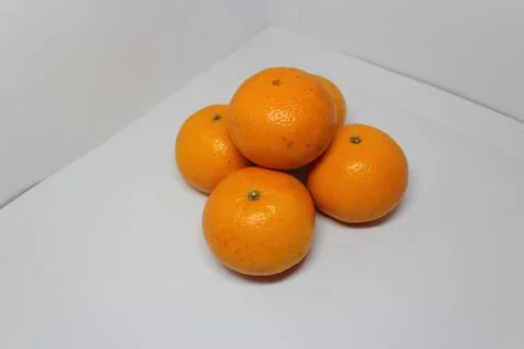 Five orange on white background Stock Photos