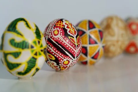 Five painted eggs stand in a line. Traditional Easter ornament. Stock Photos