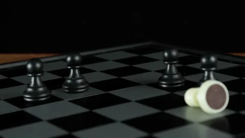 Five pawns on a chessboard. One of them is white Stock Footage 145385570