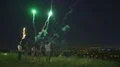 The five people hold a firework sticks on the city lights background. night time 4k or 4k+ Resolution