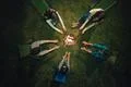 The five people hold hands near the bonfire. night time, view from above Photo