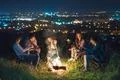 The five people rest near bonfire. night time Photo