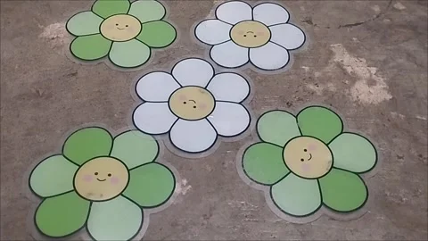 Five plastic flowers to make a hand fan Stock Footage 296303575