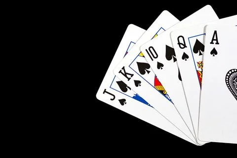 Five playing suits of peak suit on a dark background Stock Photos