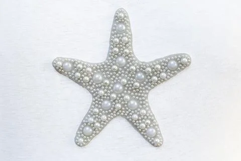 Five pointed star made of white pearls, isolated on white background Stock Photos
