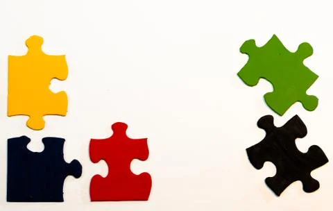Five primary-colored hand-painted pieces of a jigsaw puzzle-8923 Foto stock