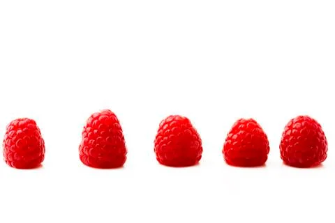 Five raspberries Stock Photos
